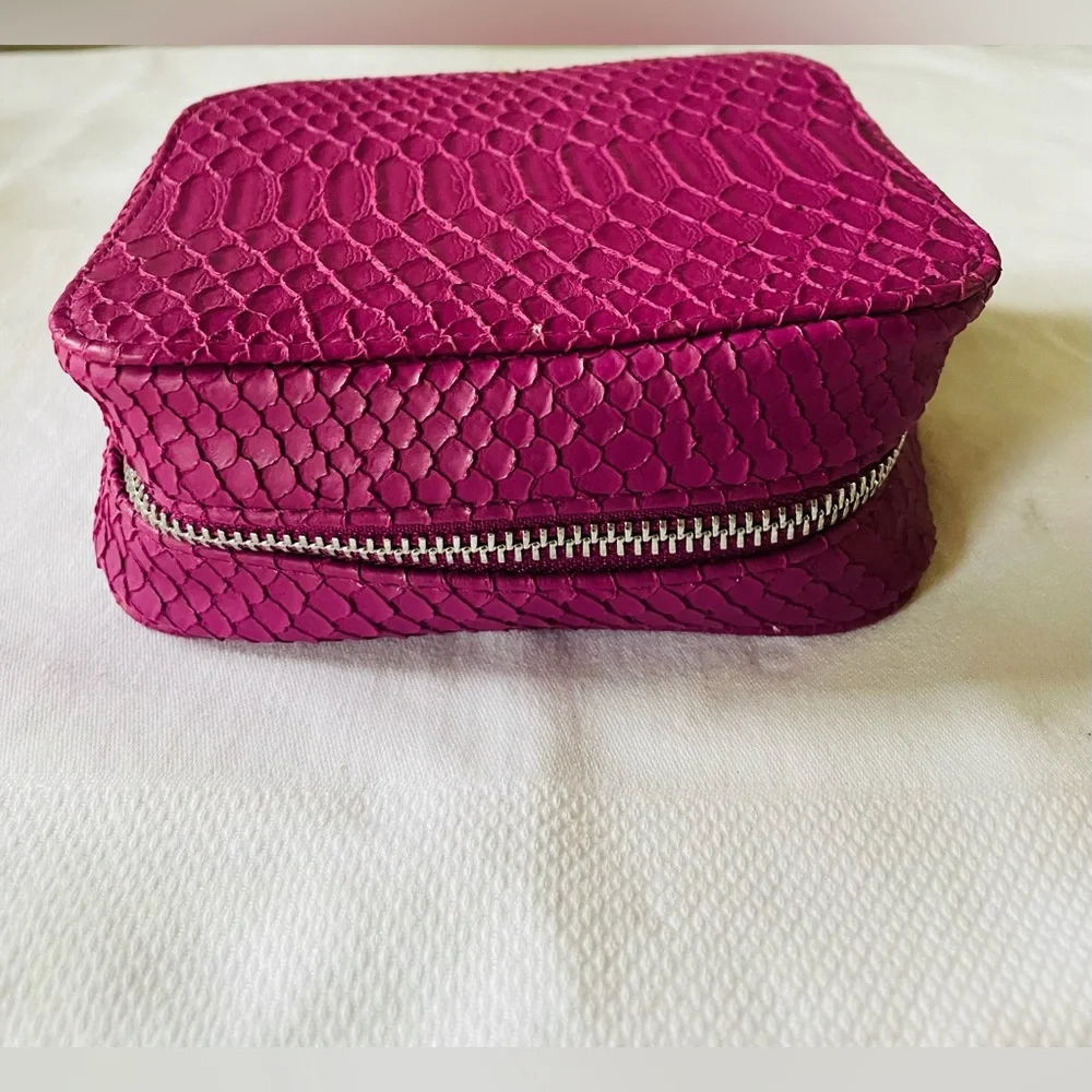 TRISH McEvoy embossed pink makeup planner